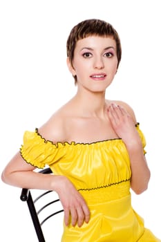 beautiful young woman wearing yellow dress isolated on white