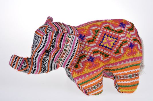 A colorful stuffed elephant isolated on white background