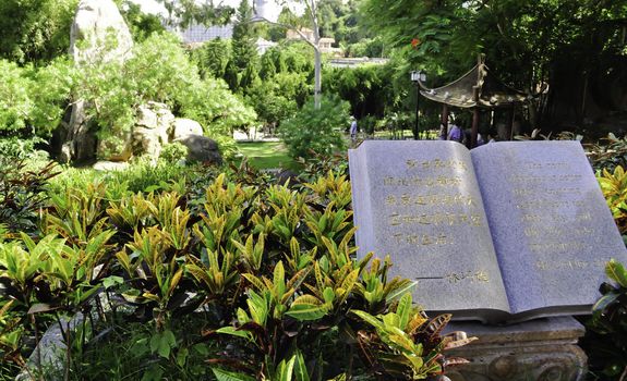 A open book statue in a asian garden park