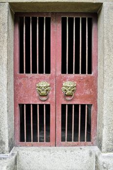 Asian knockers on a traditional style chinese door frame