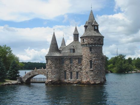 Castle on Ontario Lake in water with cloudy sky