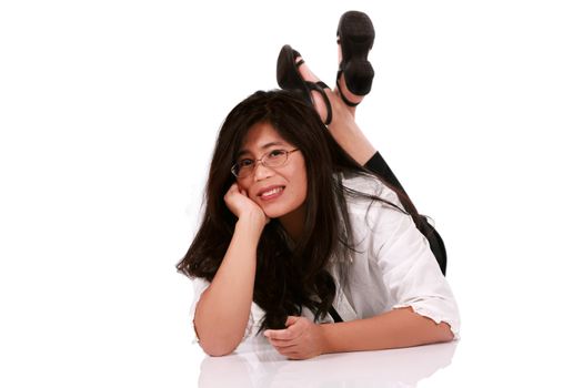 Asian woman in late thirties relaxing on floor, isolated on white