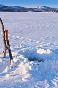 Hole for Ice-fishing through lake ice.