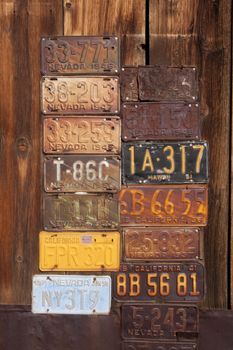 Vintage License Plates with a wood background