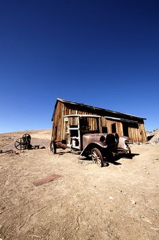 Old truck in front of an abandoned cabin