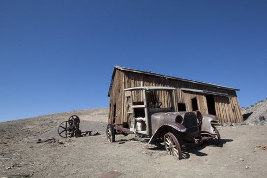 Old truck in front of an abandoned cabin