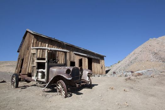 Old truck in front of an abandoned cabin