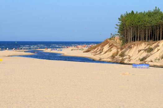 River and a cliff on the seashore
