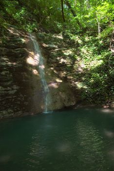 photo of the beautiful waterfall in tropical forest