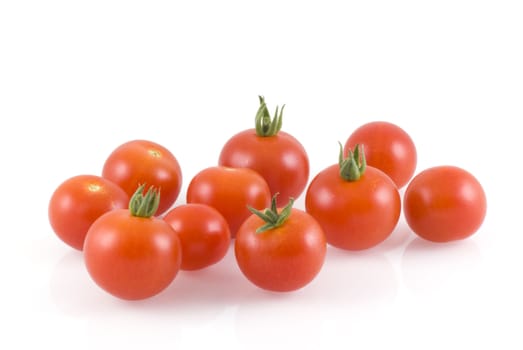 Cherry tomatoes, isolated on a white background.