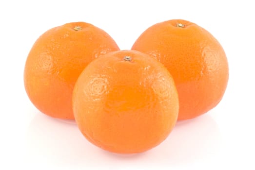 Three oranges isolated on a white background.