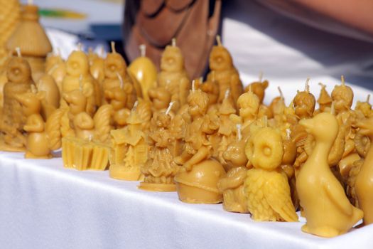 Wax traditional figurines at the street market
