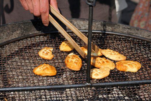 Traditional Polish smoked cheese known as oscypek on barbecue
