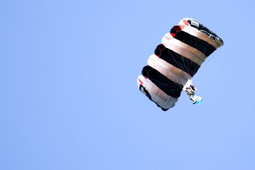 Image of a daring base jumper in action.