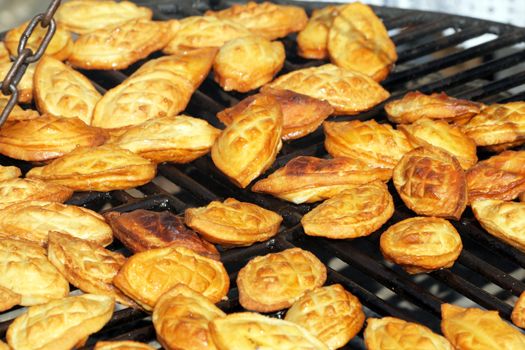 Traditional Polish smoked cheese known as oscypek on barbecue
