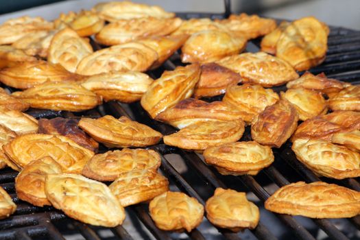 Traditional Polish smoked cheese known as oscypek on barbecue
