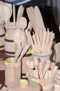 Wooden cutlery at the traditional street market
