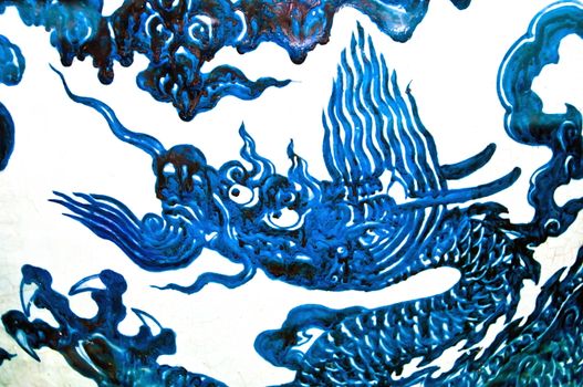 Blue chinese dragon on white background, decoration of a ming vase