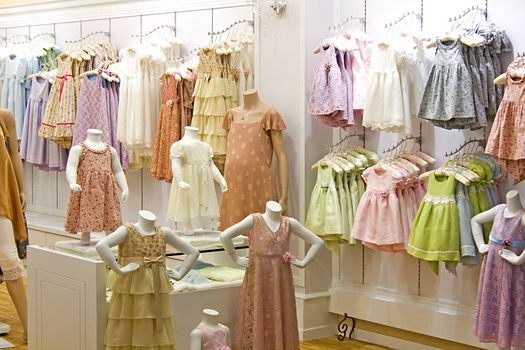 Image of children's clothes in a shop.
