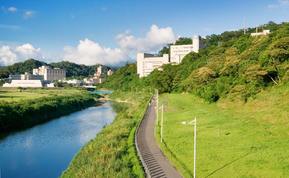 It is a cityscape photo of house near a river.
