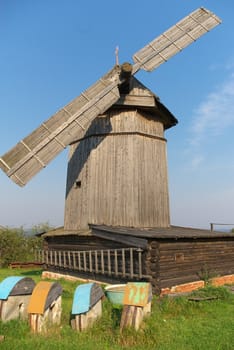 photo of the old - time  wooden wind mill
