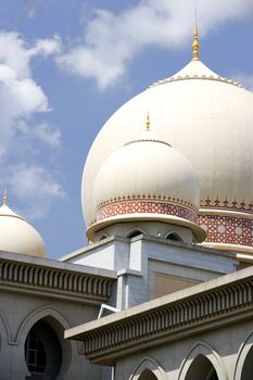Image of a domes on a bulding incorporating Islamic architecture.