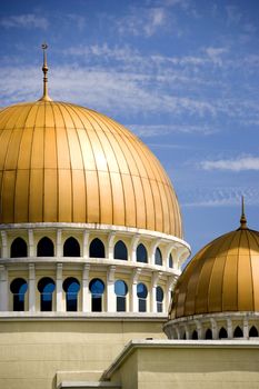 Gold coloured domes of a mosque in Malaysia.