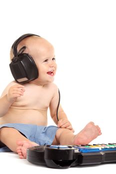 Little boy in headphones on the white background
