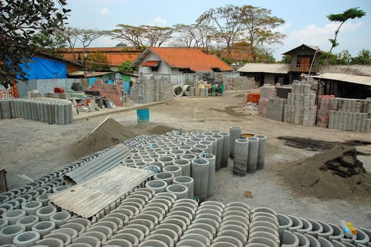 The outdoors section of a factory producing concrete and concrete shaped objects