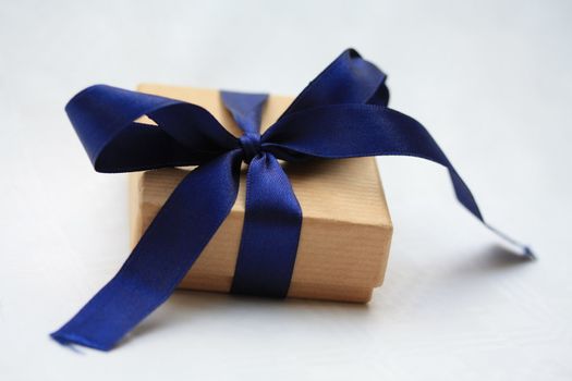 small jewel box with blue satin ribbon