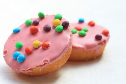 pink cupcakes with colored sprinkles, perfect for a childrens party