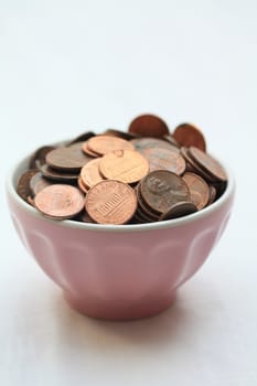 pink bowl with copper coins