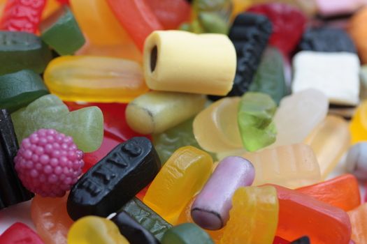 Pile of colorful candies: liquorice allsorts and wine gums