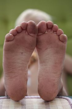 dirty feet of a playful six year old