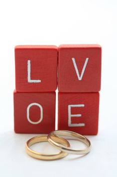 red wooden letters spelling the word "love"