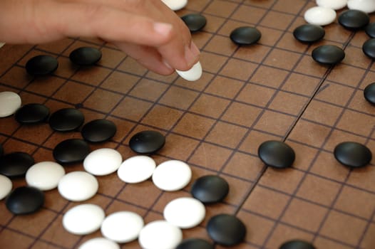 igo is kind like othelo, but its japanese traditional art game