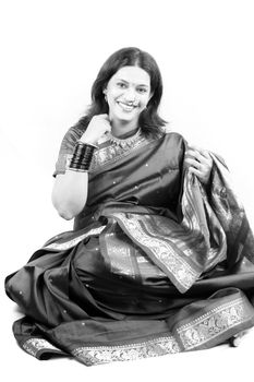 A classic black & white image of a traditional Indian woman on a white background.
