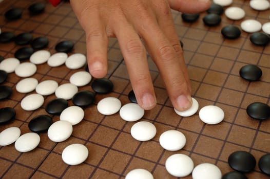 igo is kind like othelo, but its japanese traditional art game