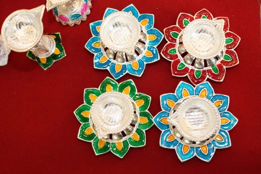 Traditional lamps made of a silver with a beautiful design, for sale in Diwali festival.