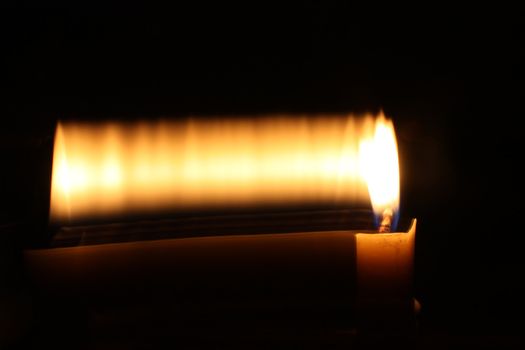 A metaphorical background showing a candle in motion, depicting a moment in time.