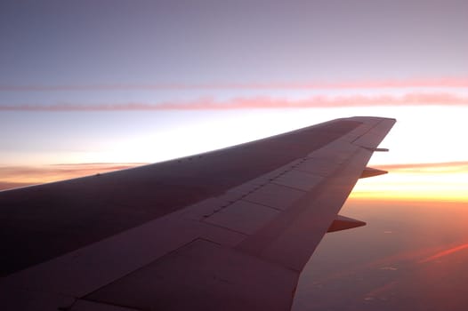 aircraft wing with blue sky as background