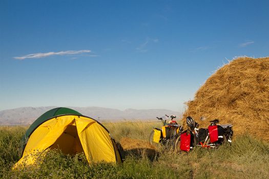 Two tent and two bicycles on the green grass - Turkey.