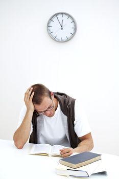 student reading under a clock