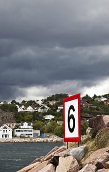 number six sign on a harbour entrance