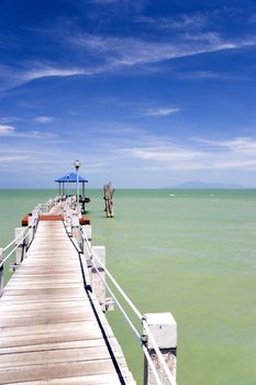 Image of a jetty against a backdrop of a beautiful sea and sky in Malaysia.