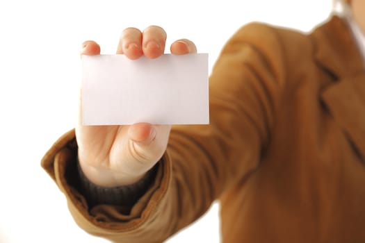 Business woman holding a card, focus on hand, isolated over white background