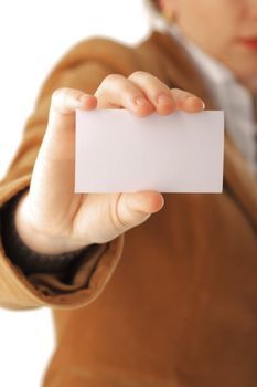 Business woman holding a card, focus on hand, isolated over white background