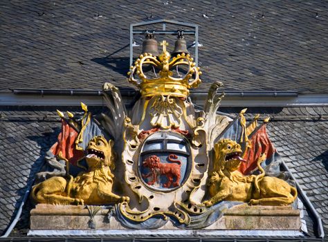 Stylized former coat-of-arms of the German city Bonn. Detail on the town-hall facade.