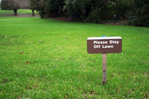 A sign on a grass field