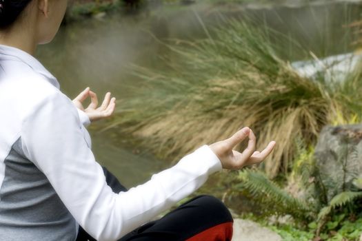 Woman relaxing by meditation/yoga
